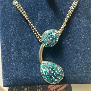 Swarovski Authentic Necklace with turquoise and blue crystals with gold chain.